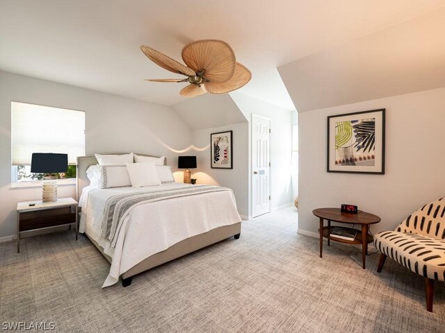 carpeted bedroom with lofted ceiling and ceiling fan