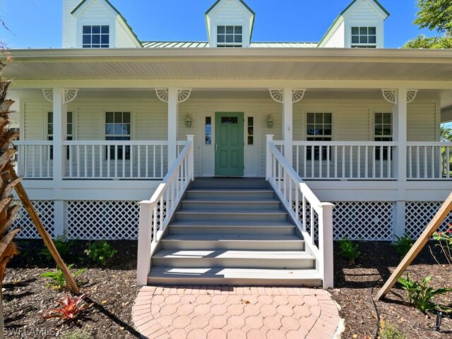 doorway to property with covered porch