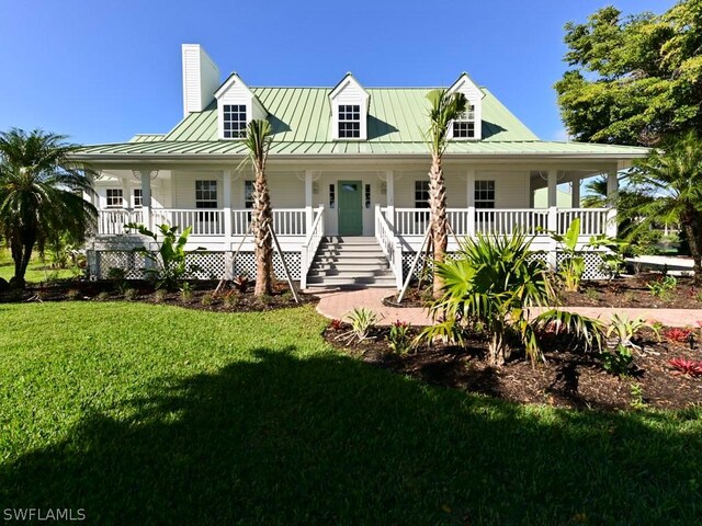 farmhouse with a front yard and a porch