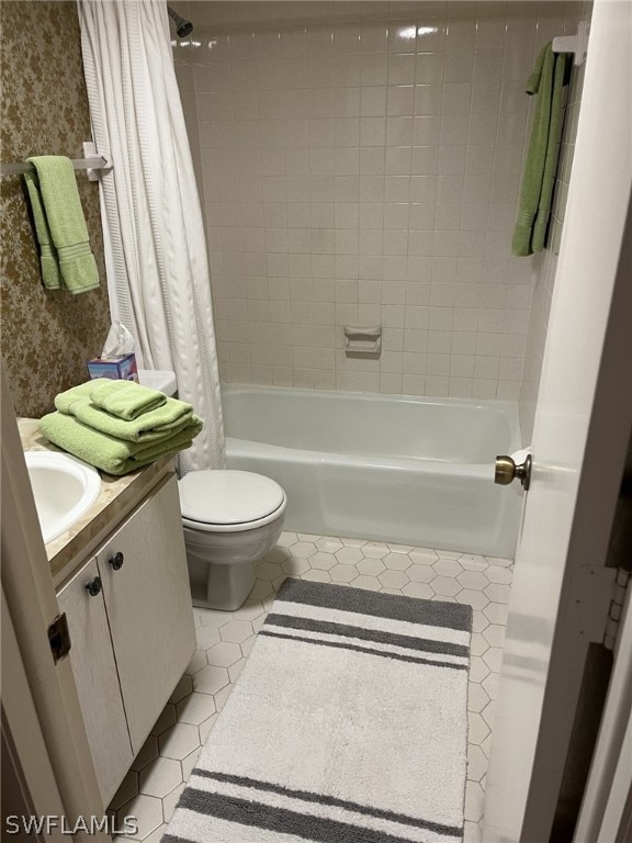 full bathroom featuring tile patterned flooring, vanity, shower / tub combo, and toilet