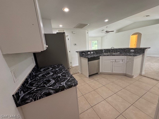 kitchen with light tile patterned floors, white cabinets, ceiling fan, appliances with stainless steel finishes, and sink