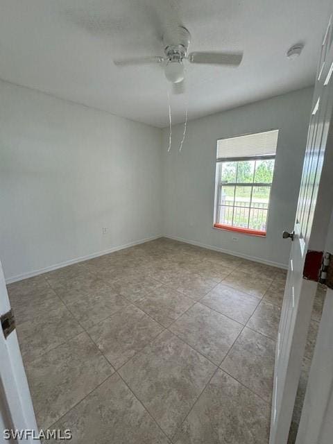 2813 52nd St W, Lehigh Acres, FL 33971 - spare room featuring a ceiling fan, tile patterned flooring, and a smoke detector