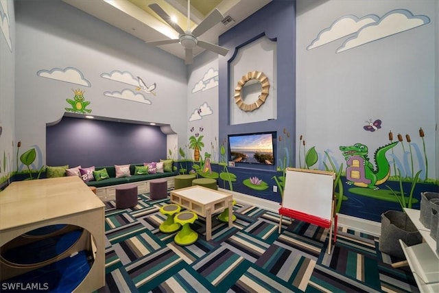 recreation room featuring ceiling fan and carpet flooring