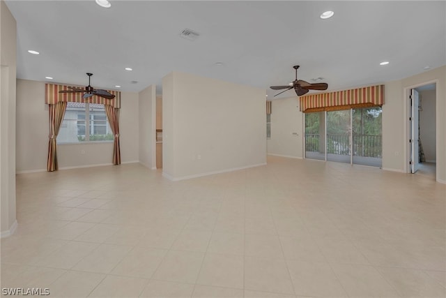 unfurnished room featuring ceiling fan and light tile patterned floors