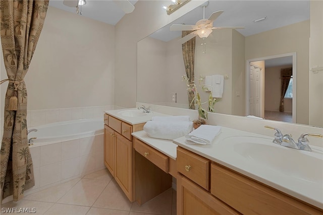 bathroom with ceiling fan, tiled tub, tile patterned floors, and vanity