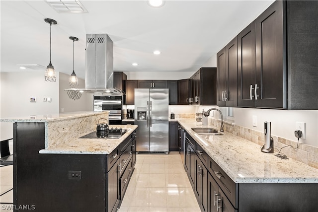 kitchen with decorative light fixtures, stainless steel appliances, island exhaust hood, sink, and light tile patterned floors