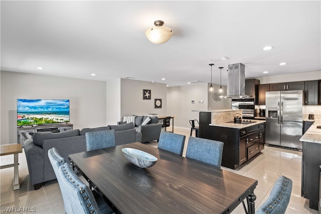 dining space featuring light tile patterned floors