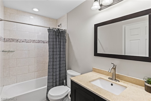 full bathroom with vanity, toilet, and shower / tub combo