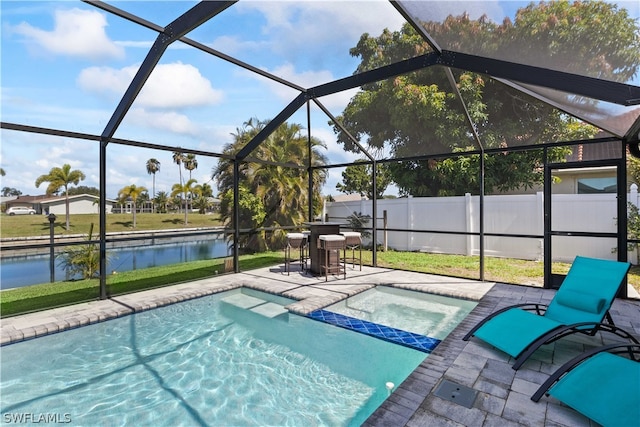 view of pool featuring a patio and glass enclosure