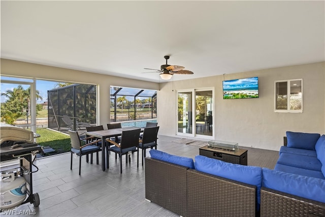 interior space with ceiling fan