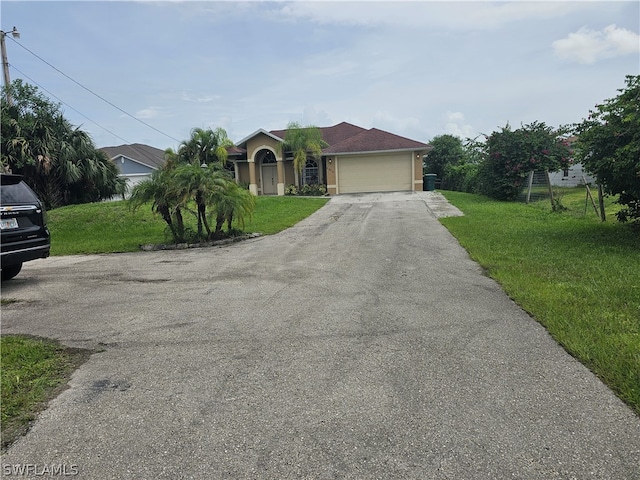 view of front facade featuring a garage and a front lawn