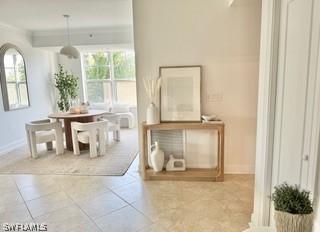 tiled dining room with crown molding