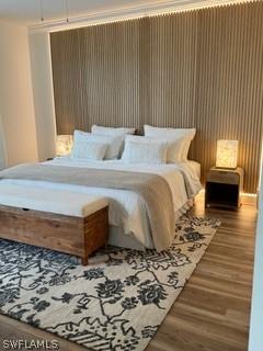 bedroom with wood-type flooring