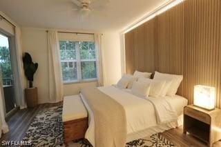 bedroom with dark hardwood / wood-style floors and ceiling fan