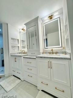 bathroom featuring vanity and an enclosed shower