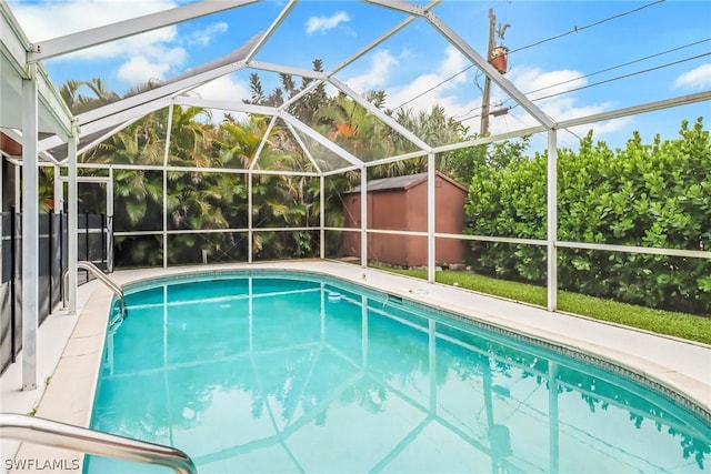 view of swimming pool featuring a lanai and a storage unit