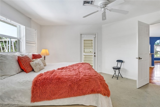 carpeted bedroom featuring ceiling fan