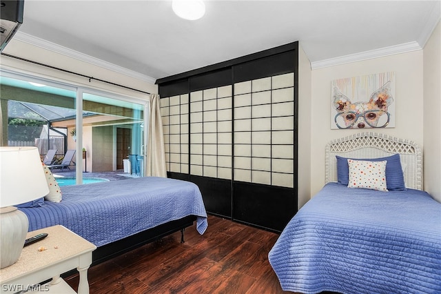 bedroom with crown molding, dark wood-type flooring, and access to exterior