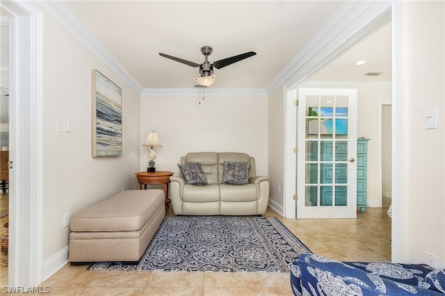 living area with crown molding, ceiling fan, and tile patterned floors