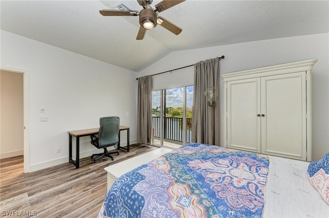 bedroom featuring light hardwood / wood-style flooring, lofted ceiling, ceiling fan, and access to outside