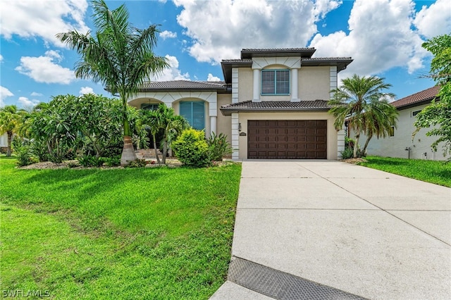 mediterranean / spanish-style home featuring a front yard and a garage