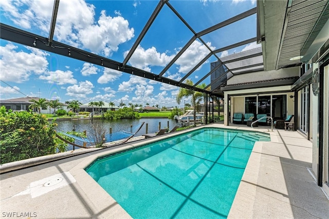 view of swimming pool featuring a lanai, a patio, and a water view