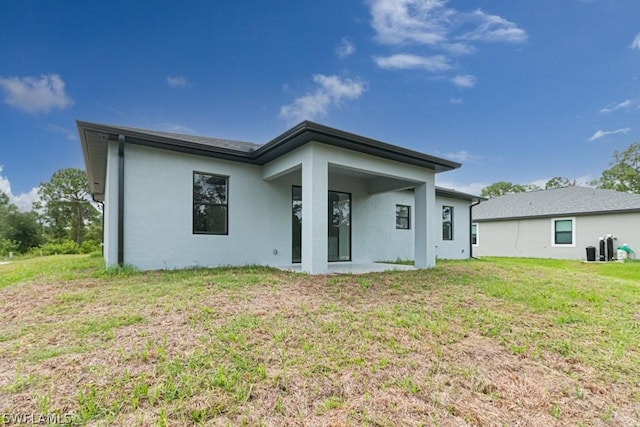 back of house with a yard