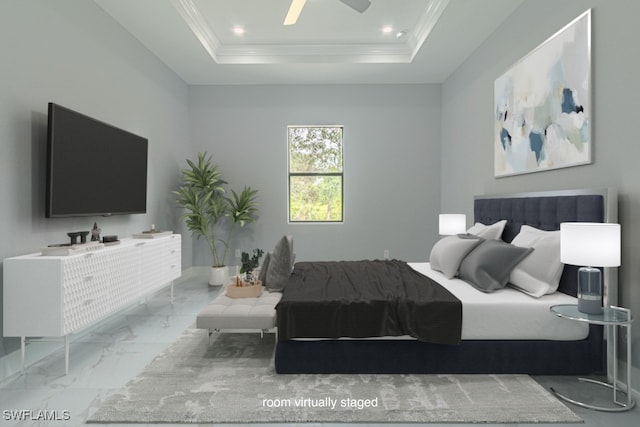 bedroom with a tray ceiling and ceiling fan