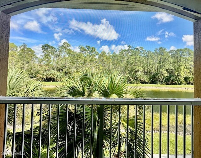 balcony featuring a water view