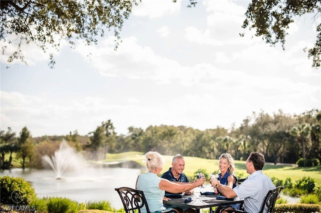 surrounding community featuring a water view