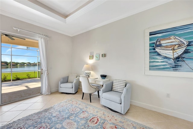 sitting room with ceiling fan, a water view, light tile patterned floors, and crown molding