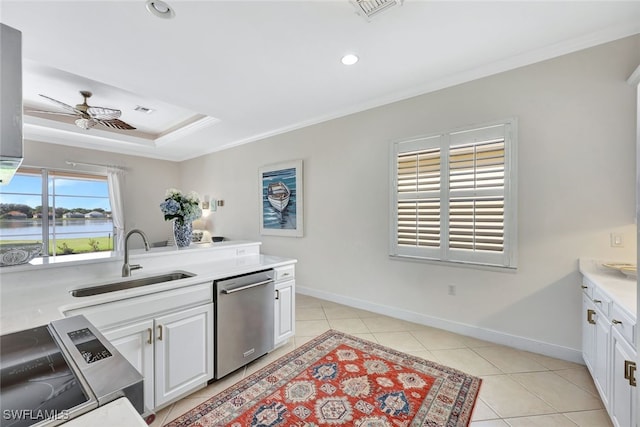 kitchen featuring ceiling fan, sink, white cabinets, a water view, and appliances with stainless steel finishes