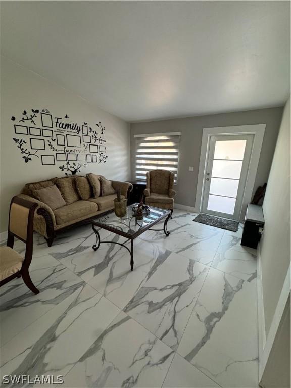 living room with light tile patterned floors