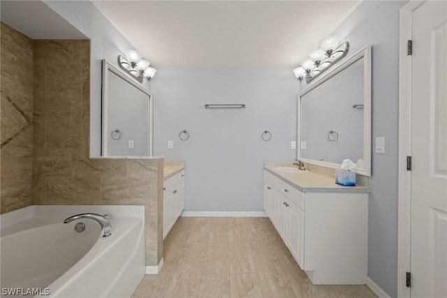 bathroom with a bathtub and vanity