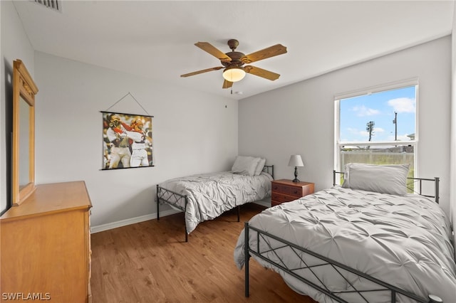 bedroom featuring ceiling fan and light hardwood / wood-style floors