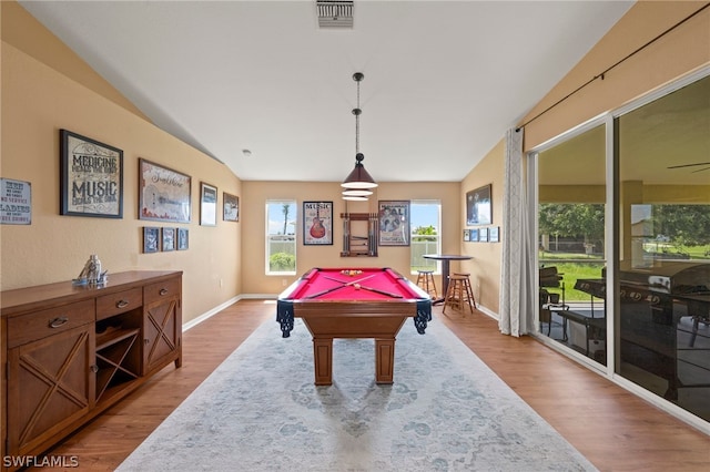 rec room with ceiling fan, vaulted ceiling, pool table, and light hardwood / wood-style floors