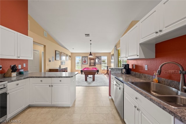 kitchen featuring white cabinets, pool table, and vaulted ceiling