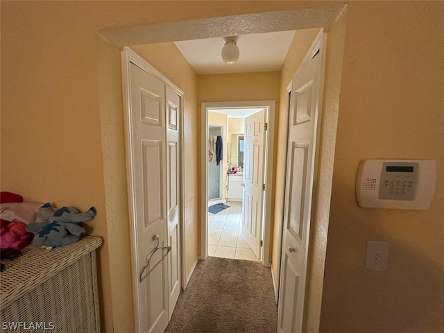 corridor with light tile patterned floors