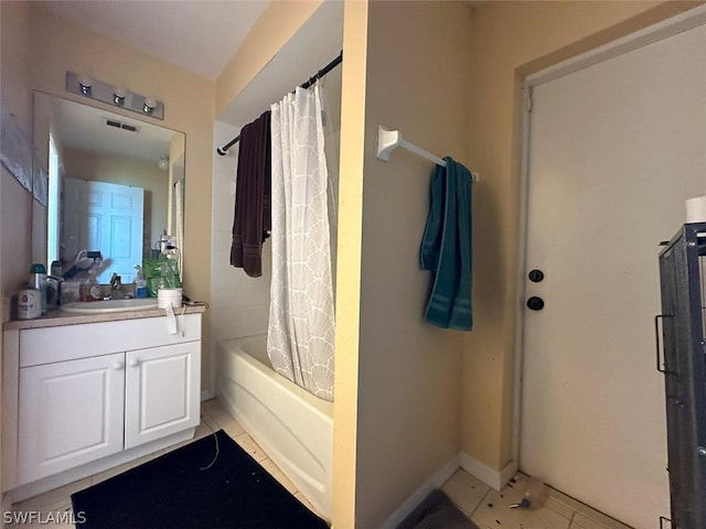 bathroom with vanity, tile patterned flooring, and shower / bathtub combination with curtain