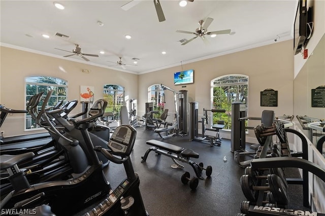 exercise room featuring crown molding