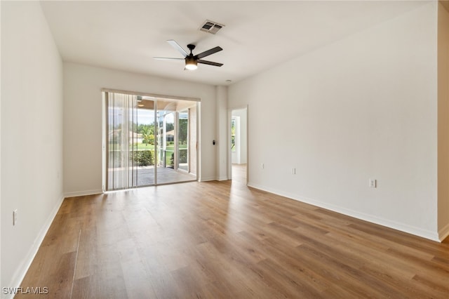 spare room with ceiling fan and hardwood / wood-style floors