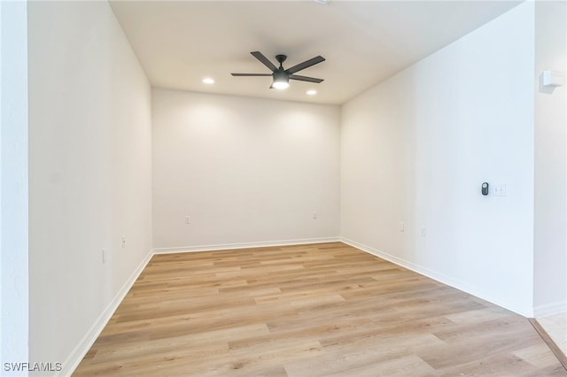 spare room with ceiling fan and light hardwood / wood-style floors