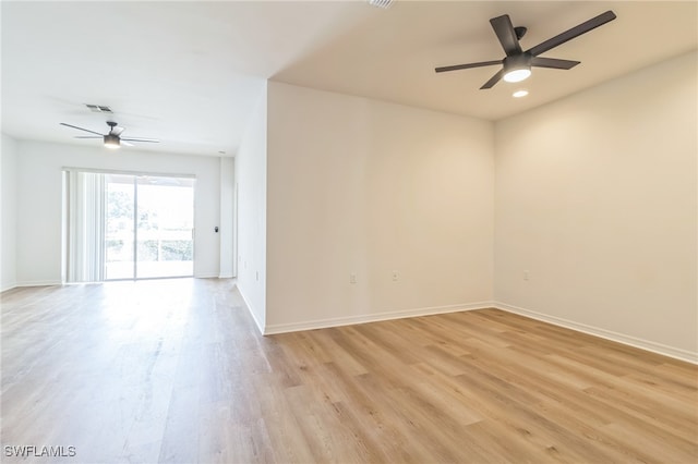 spare room featuring ceiling fan and light wood-type flooring