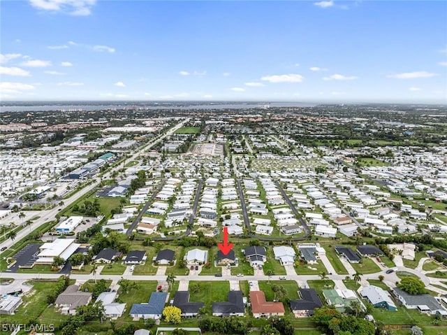 birds eye view of property with a residential view