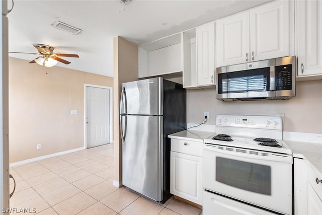 kitchen with light tile patterned floors, a ceiling fan, white cabinets, light countertops, and appliances with stainless steel finishes