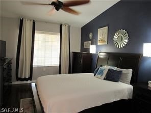 bedroom featuring ceiling fan and vaulted ceiling