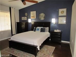 bedroom featuring dark hardwood / wood-style floors and ceiling fan