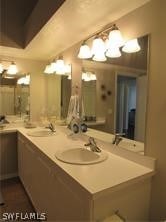 bathroom featuring dual vanity