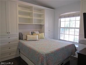 bedroom featuring multiple windows