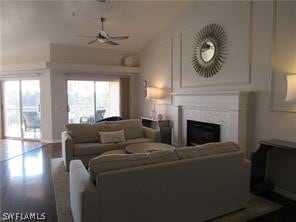 living room featuring hardwood / wood-style flooring and ceiling fan